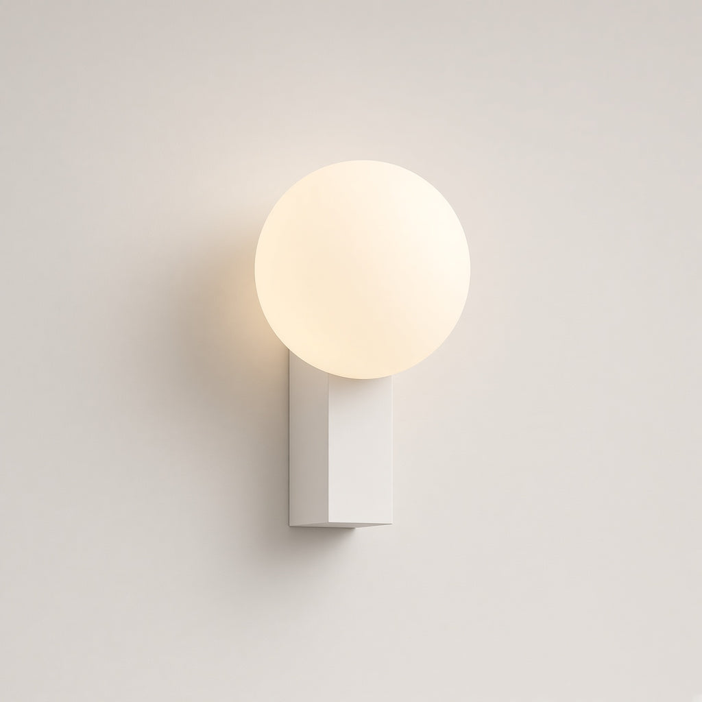 Aldwych Opal Globe Wall Light – studio photo, lit, on a cream background