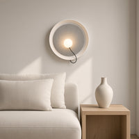 Chiltern Disc Wall Light – above a sofa in a living room