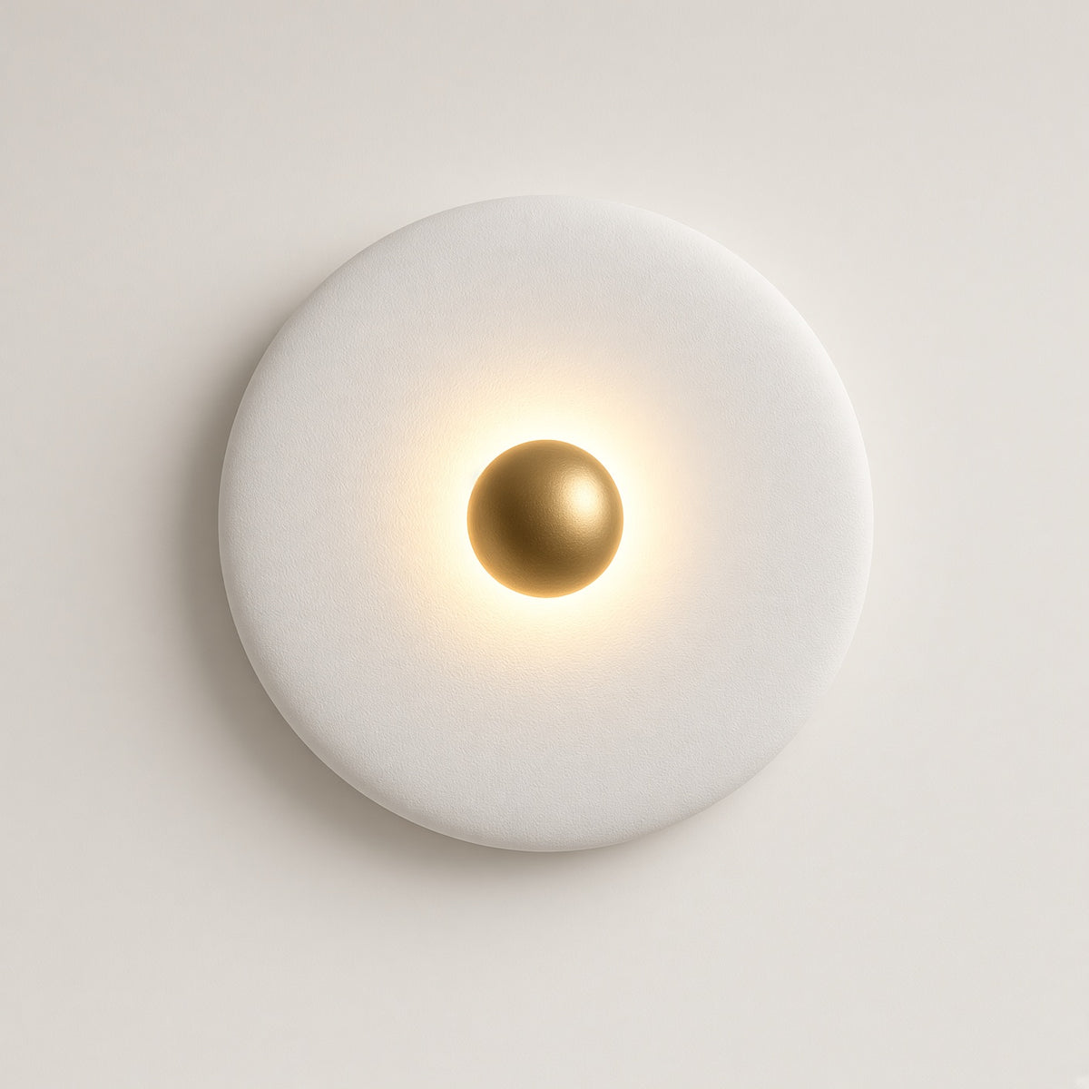 Clun Halo Disc Wall Light – studio photo, lit, on a cream background