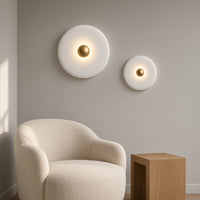 Clun Halo Disc Wall Light – two discs above an armchair