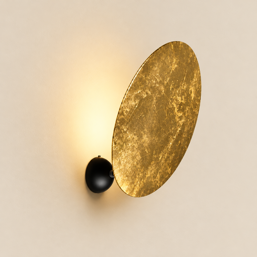 Coombe Gold Disc Wall Light – studio photo, lit, on a cream background
