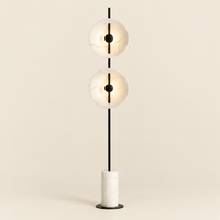 Dunster Twin Disc Floor Lamp – switched on, studio view