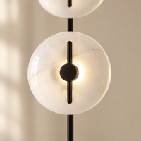 Dunster Twin Disc Floor Lamp – close-up of a glowing disc
