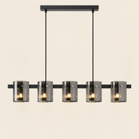 Esher Smoked Glass Linear Pendant Light – switched on, studio view