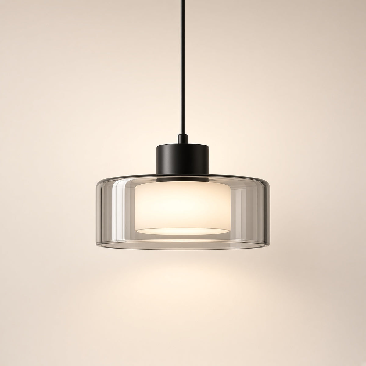 Fawley Smoked Glass Drum Pendant Light – studio photo, lit, on a cream background