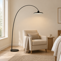 Greta Arc Floor Lamp – in a bedroom reading corner