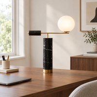 Haworth Black Marble Globe Table Lamp – on a desk