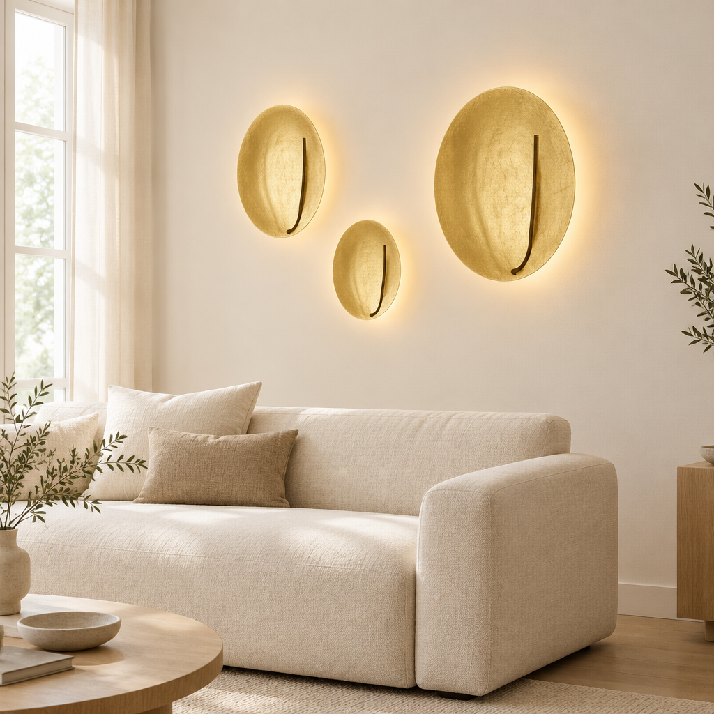 Kilve Gold Disc Wall Light – a group on a living-room wall