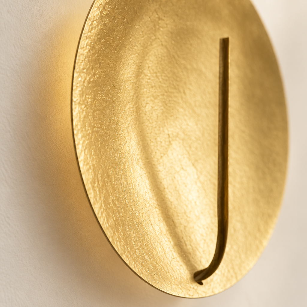 Kilve Gold Disc Wall Light – close-up of the textured gold surface