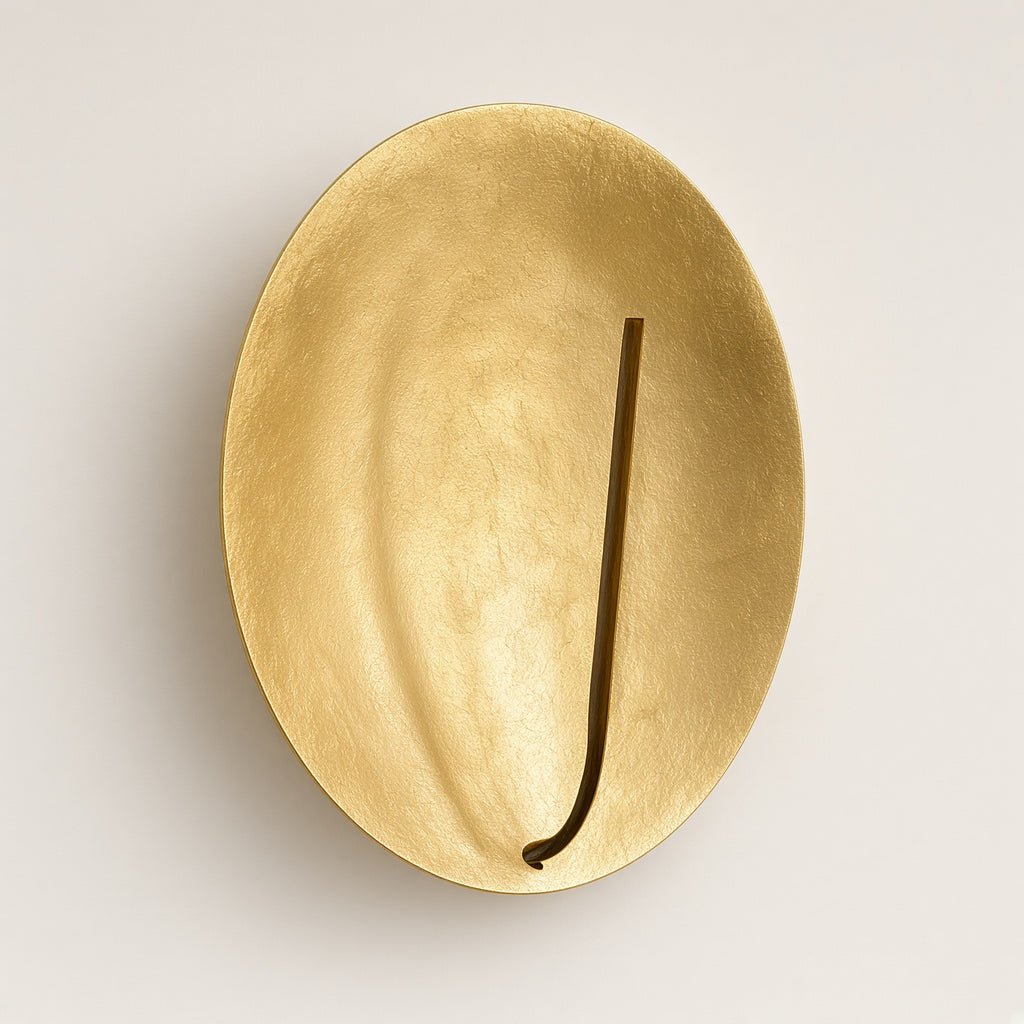 Kilve Gold Disc Wall Light switched off on a plain background