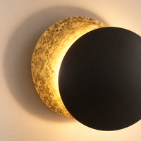 Longleat Eclipse Wall Light – close-up of the textured brass disc