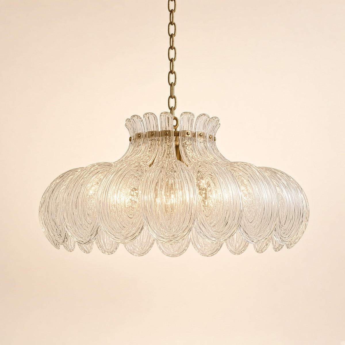 Malham Textured Glass Pendant Light – studio photo, lit, on a cream background