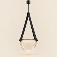 Moreton Strap Glass Pendant Light – studio photo, lit, on a cream background