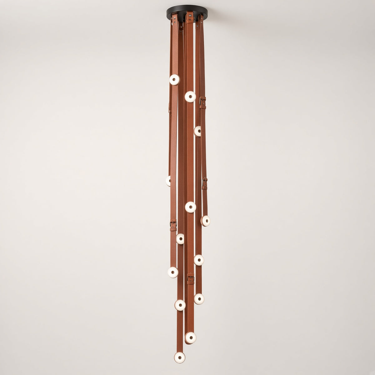 Mortlake Leather Chandelier switched off on a plain background