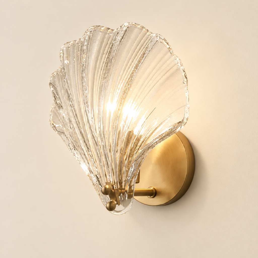 Netley Clear Shell Wall Light – studio photo, lit, on a cream background