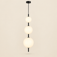 Norham Opal Glass Bubble Pendant Light – studio photo, lit, on a cream background