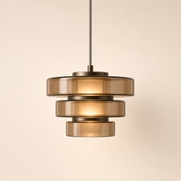 Oakley Tinted Glass Pendant Light – studio photo, lit, on a cream background