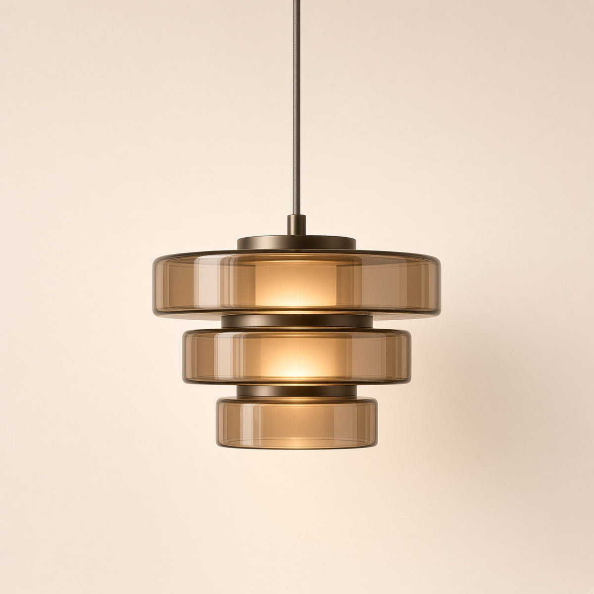 Oakley Tinted Glass Pendant Light – studio photo, lit, on a cream background