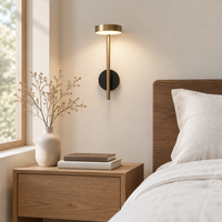 Ouse Bronze Wall Light – beside a bedside table