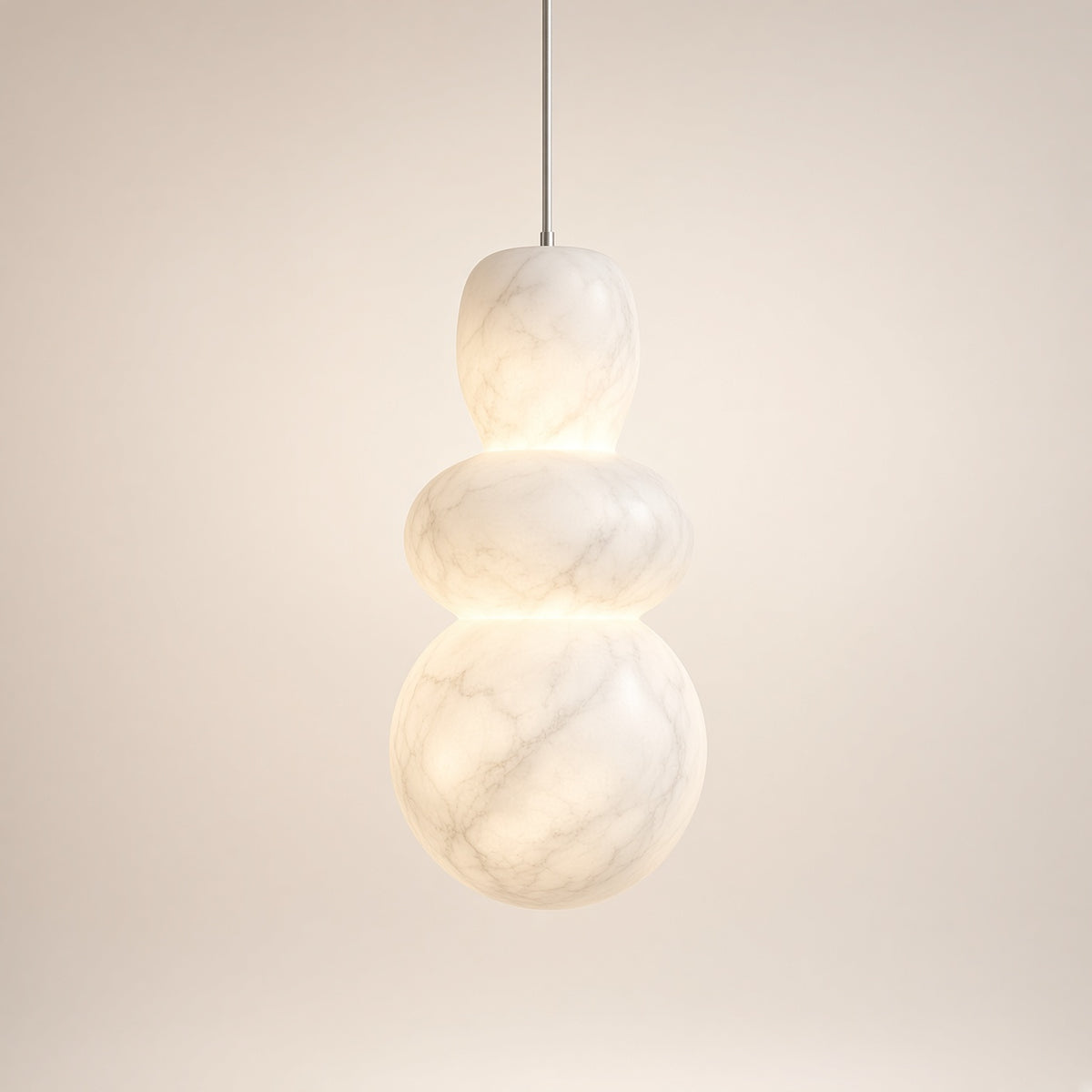 Purbeck Cloud Stone Pendant Light – studio photo, lit, on a cream background