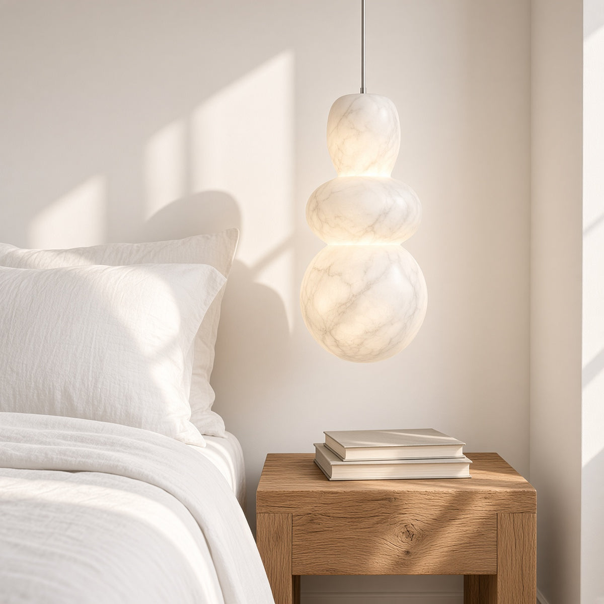 Purbeck Cloud Stone Pendant Light – hanging beside a bed