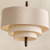 Seaton Tiered Fabric Pendant Light – close-up of the fabric tiers and wood finial
