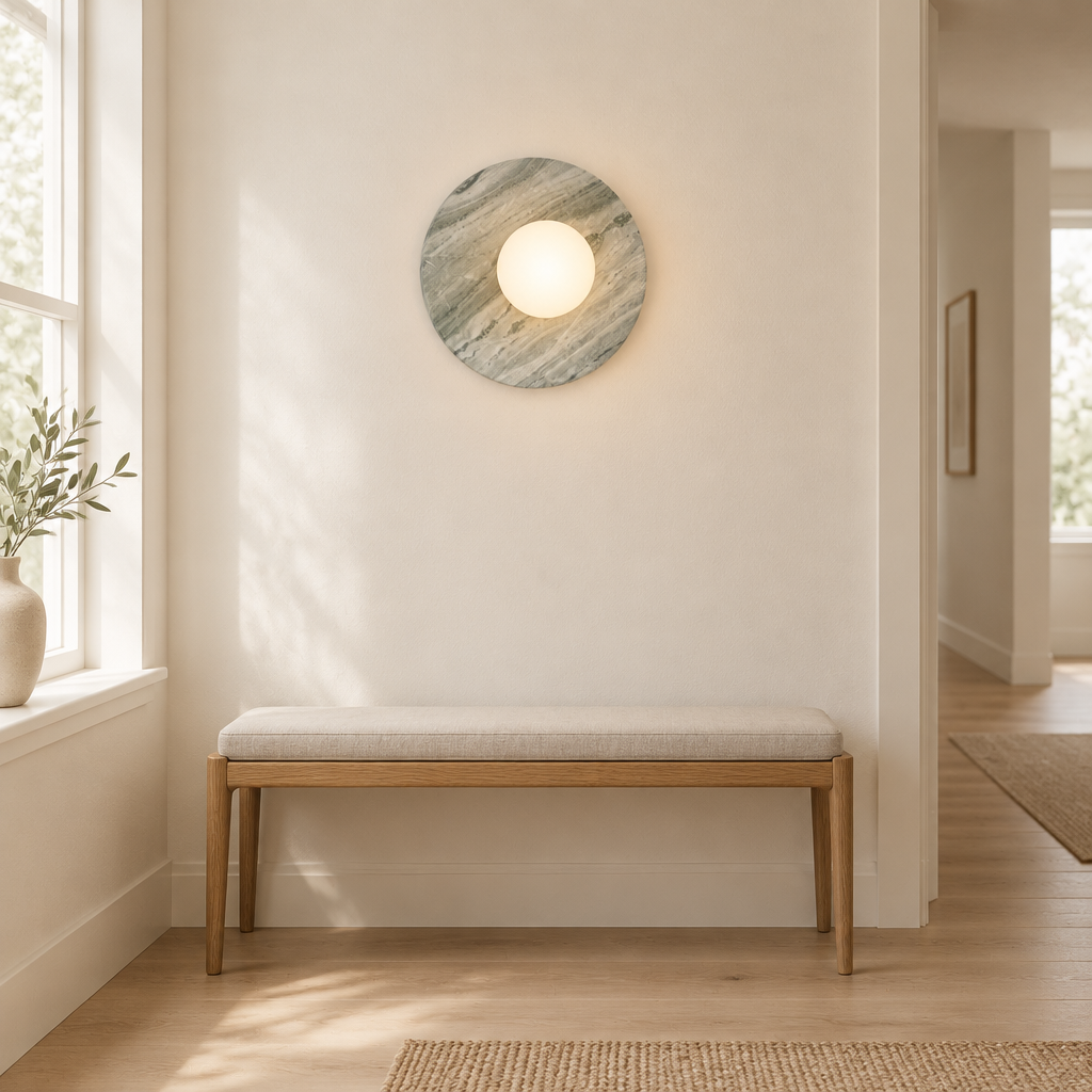 Whitby Marble-Effect Wall Light – in a hallway